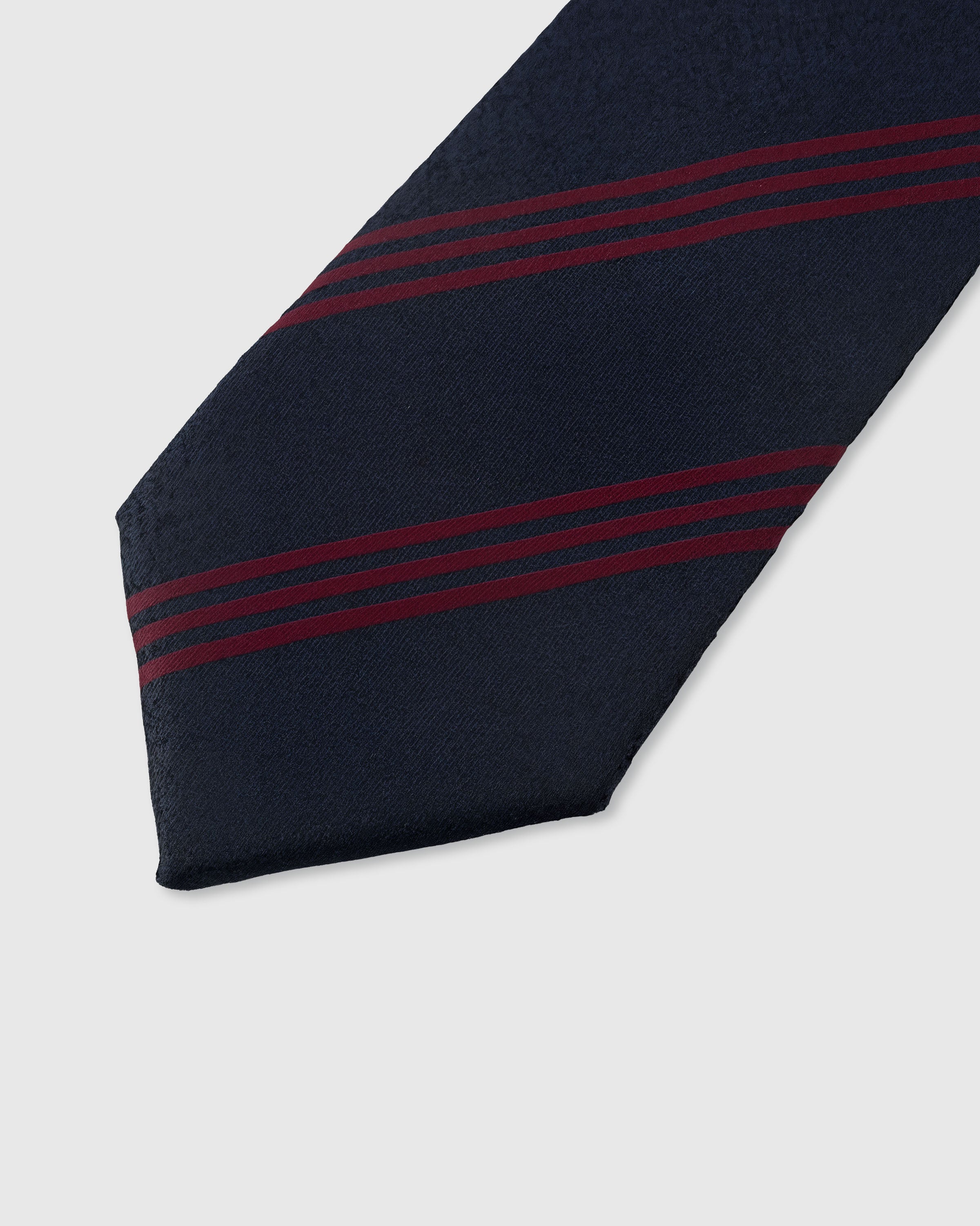 STICKYZOO NAVY CRIMSON STRIPE TIE — hand-embroidered detail showing crimson red triple diagonal stripes, stitched not printed