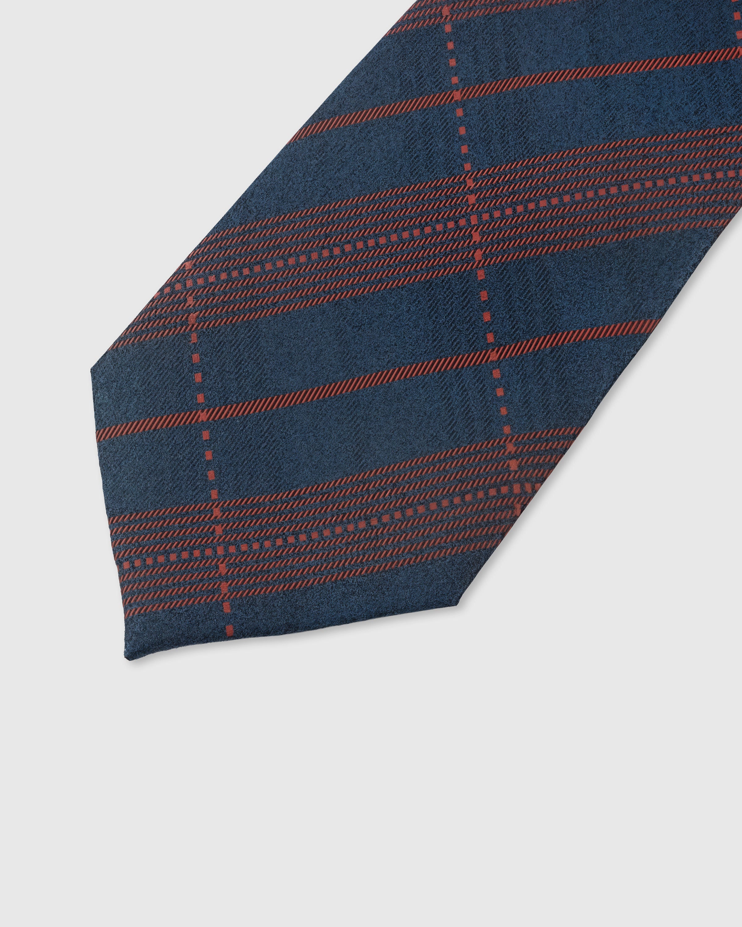 Ember tartan check detail on navy mulberry silk tie showing raised hand-embroidered grid pattern by STICKYZOO