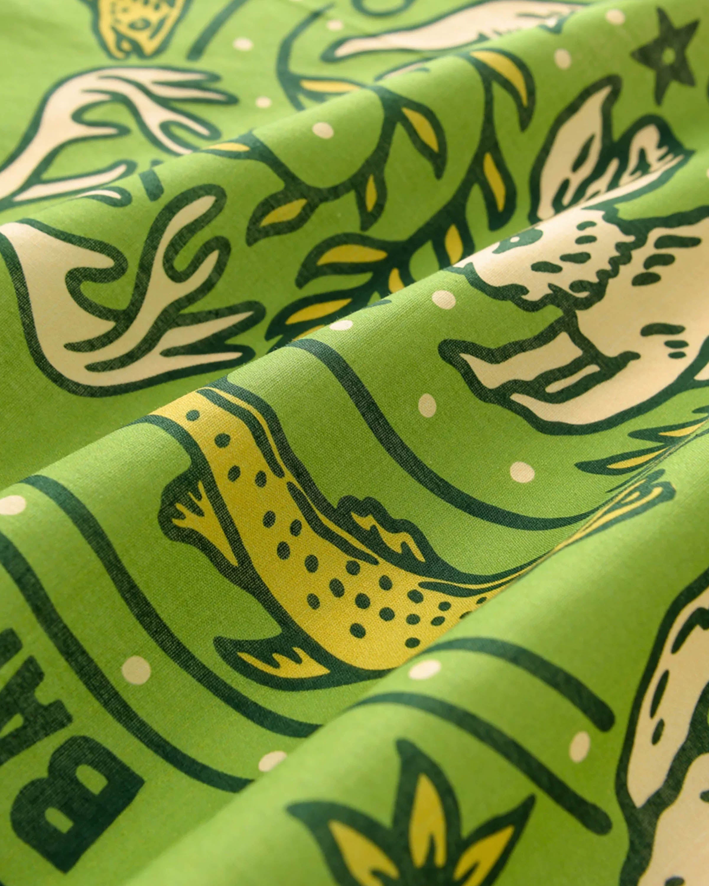 STICKYZOO wildwood grove silk scarf print detail showing the hand-illustrated ochre trout on green silk
```