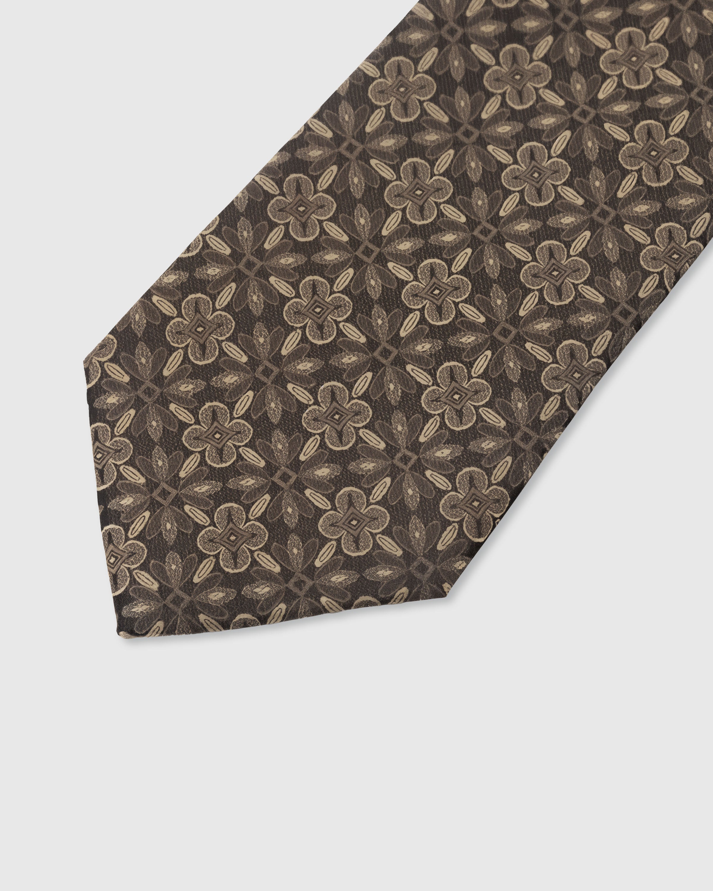 {Embroidered medallion tile detail} Medallion tile detail on walnut brown mulberry silk tie showing embroidered pattern by STICKYZOO