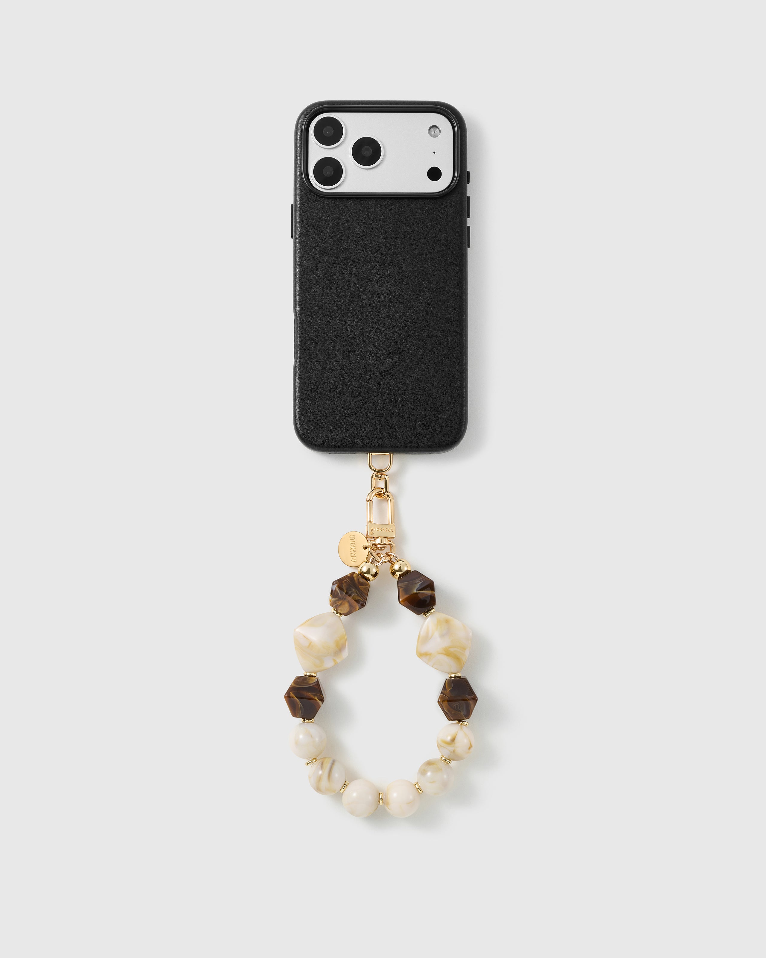 Handmade beaded phone strap on a black case, rated 4.9 across 5,000+ reviews
