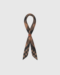 Silk gingham scarf coiled with a leather wrap showing the two-scale check and the small-square drape