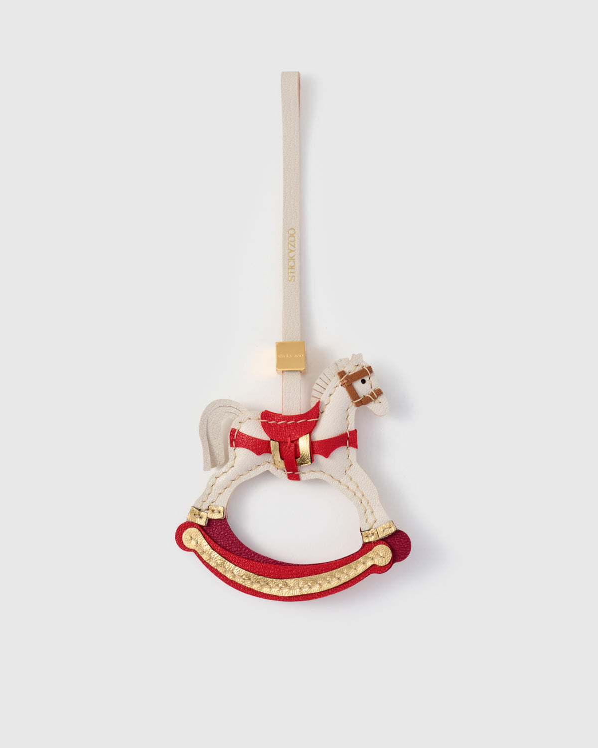 THE ROCKING HORSE CHARM