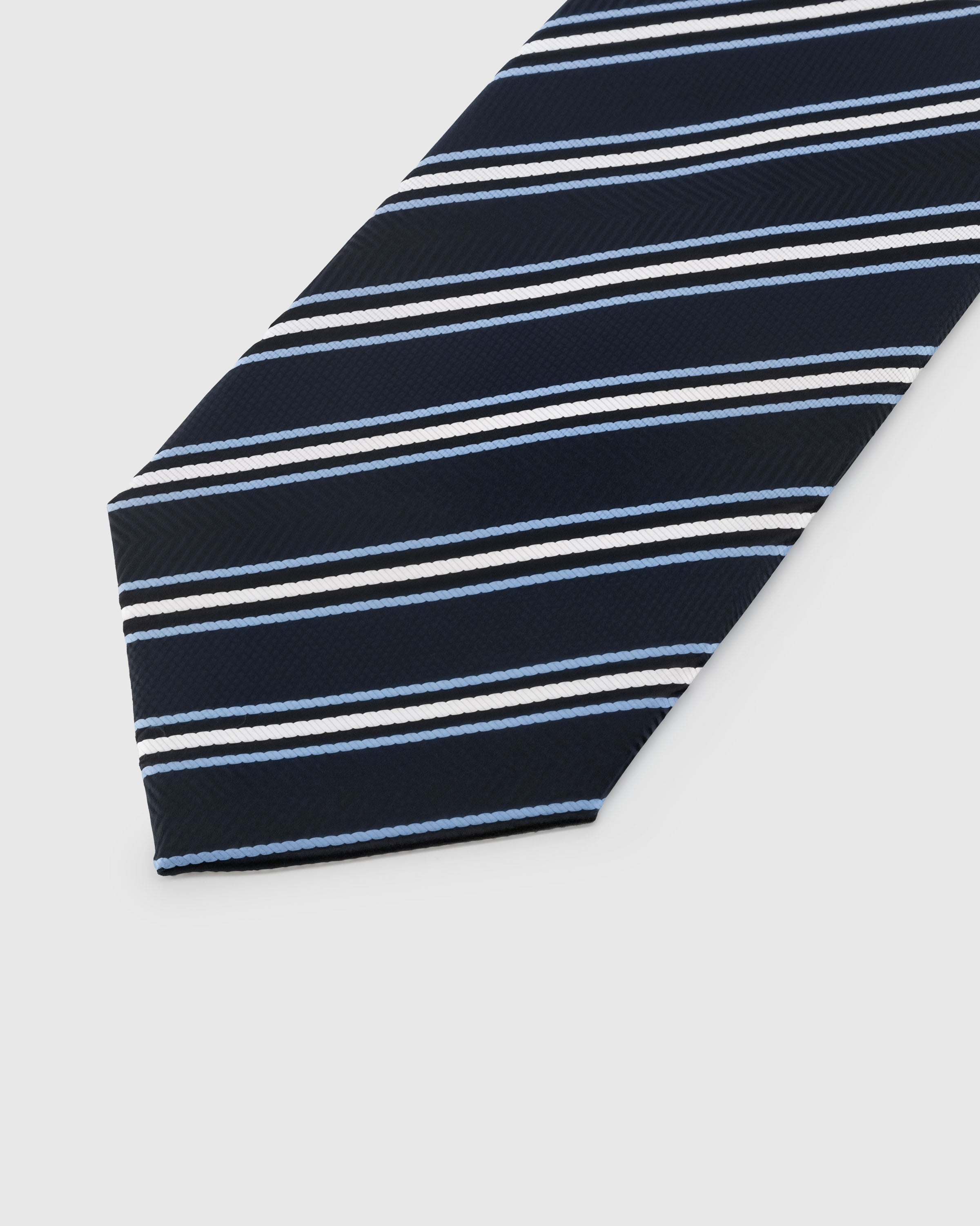 {{Real thread, real texture}} Sky blue and white regiment stripe detail on navy herringbone mulberry silk showing hand-embroidered thread by STICKYZOO