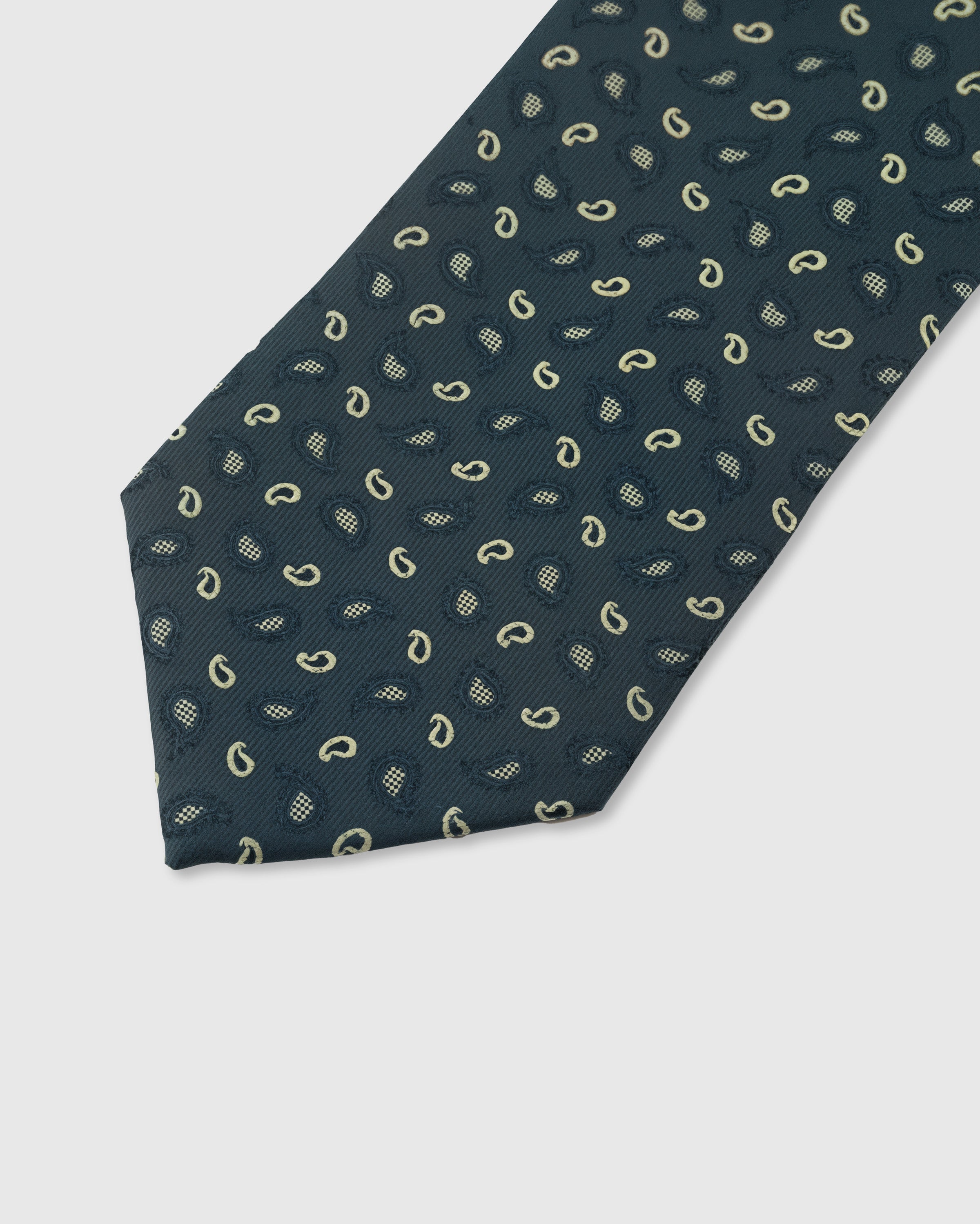 Ivory micro paisley detail on petrol mulberry silk tie showing raised hand-embroidered motifs by STICKYZOO