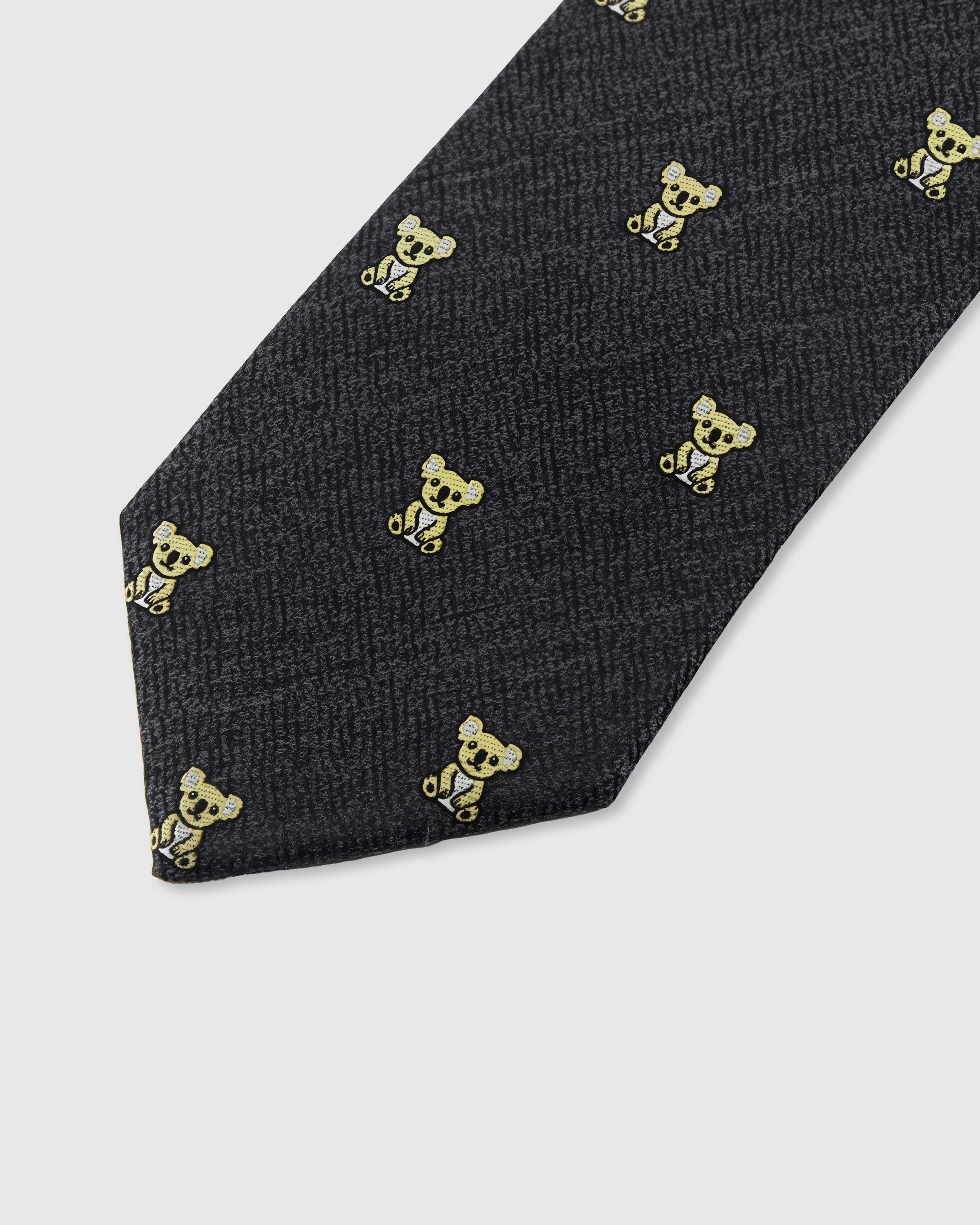 STICKYZOO CHARCOAL KOALA TIE — hand-embroidered detail showing gold-toned embroidered koala motifs, stitched not printed
