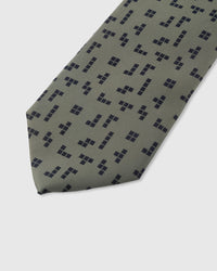 Navy geometric square cluster detail on sage mulberry silk tie showing raised hand-embroidered motifs by STICKYZOO