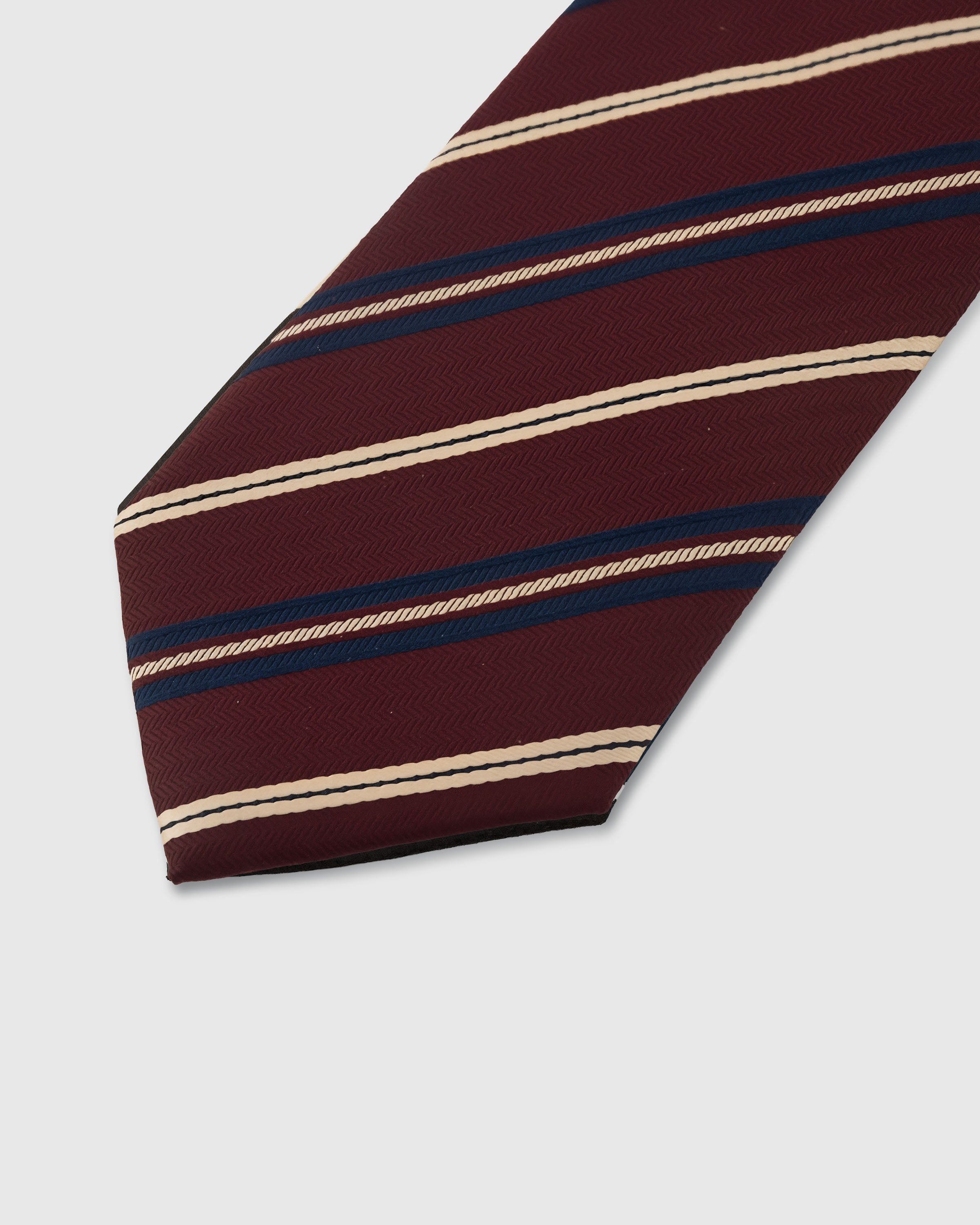 {Embroidered regimental stripe detail} Regimental stripe detail on bordeaux mulberry silk tie showing embroidered pattern by STICKYZOO