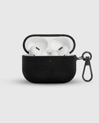 Onyx Black Alcantara case open with AirPods Pro inside and suede-lined lid