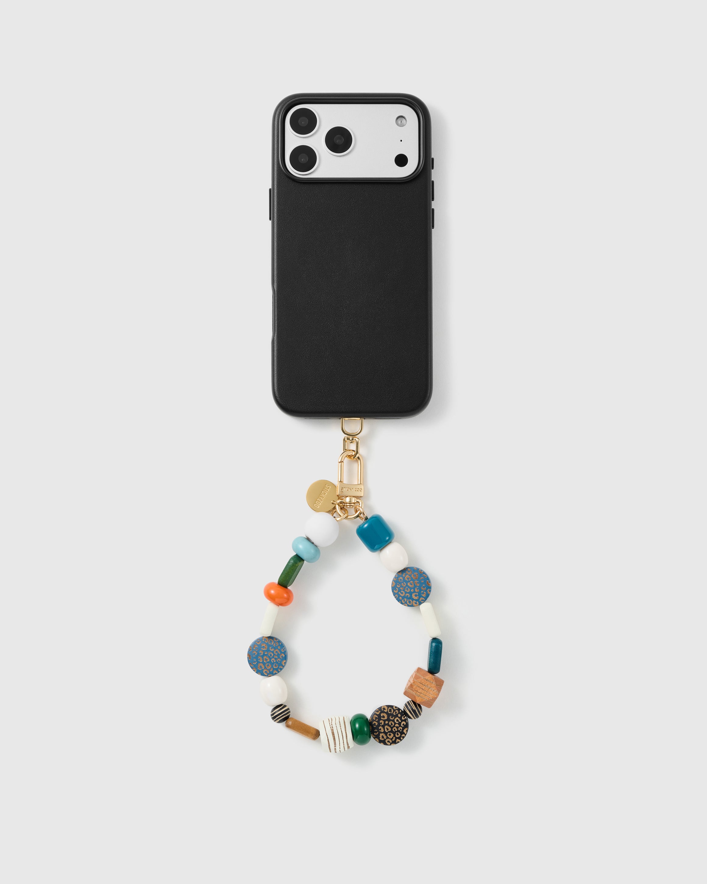 Handmade beaded phone strap on a black case, rated 4.9 across 5,000+ reviews