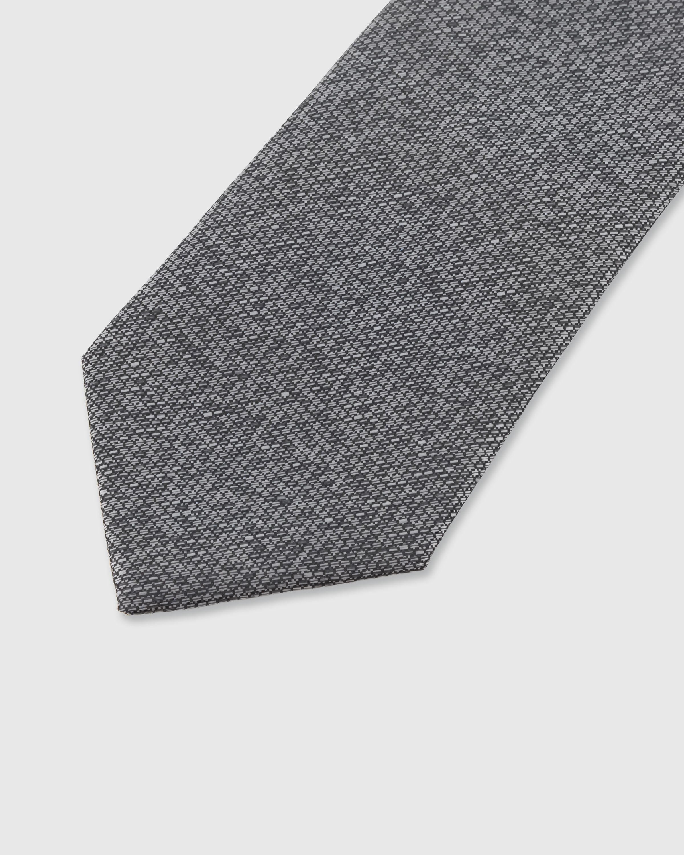 STICKYZOO Graphite Lattice Tie — detail of hand-embroidered micro lattice on pure mulberry silk