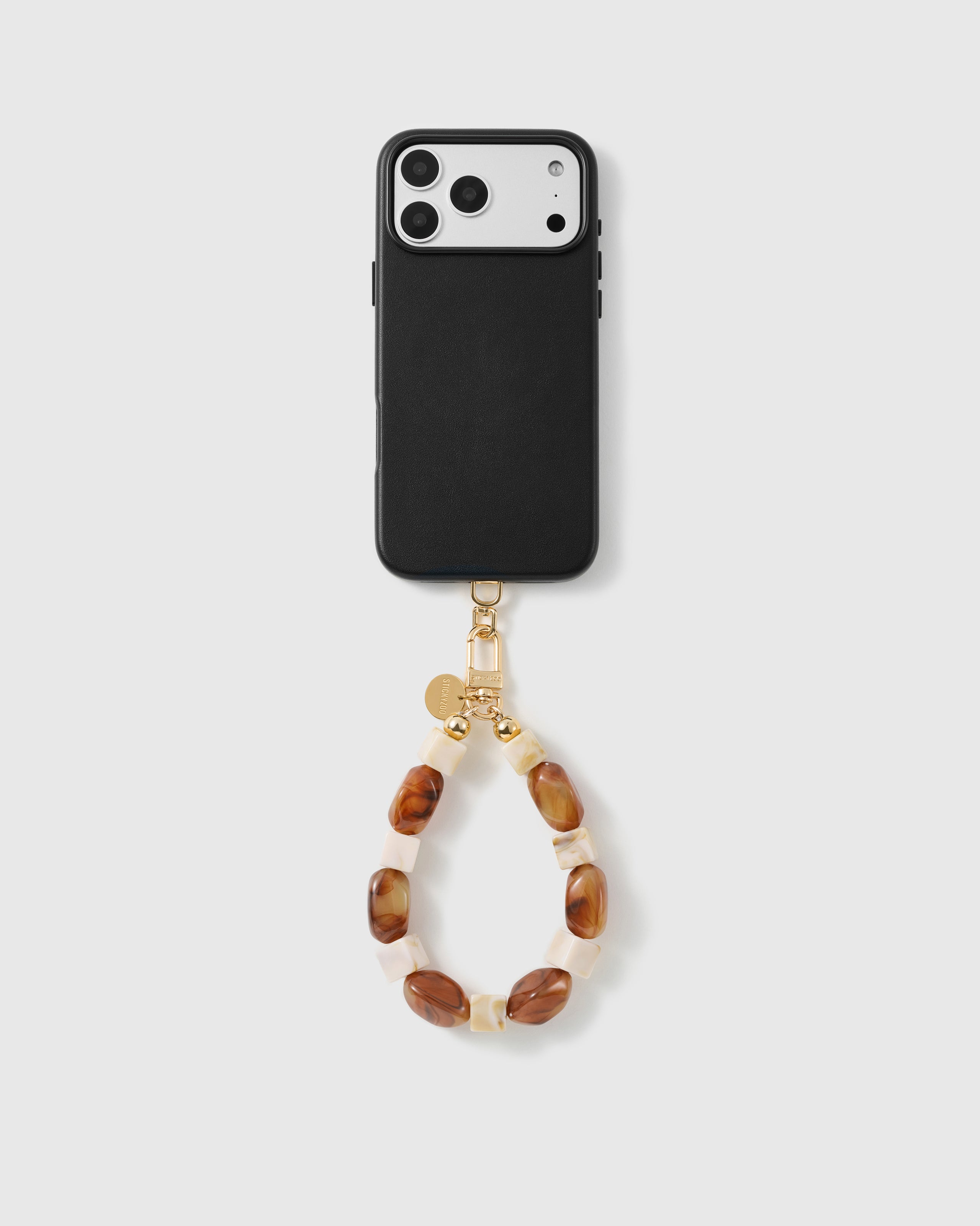 Handmade beaded phone strap on a black case, rated 4.9 across 5,000+ reviews