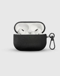 Charcoal Alcantara case open with AirPods Pro inside and suede-lined lid