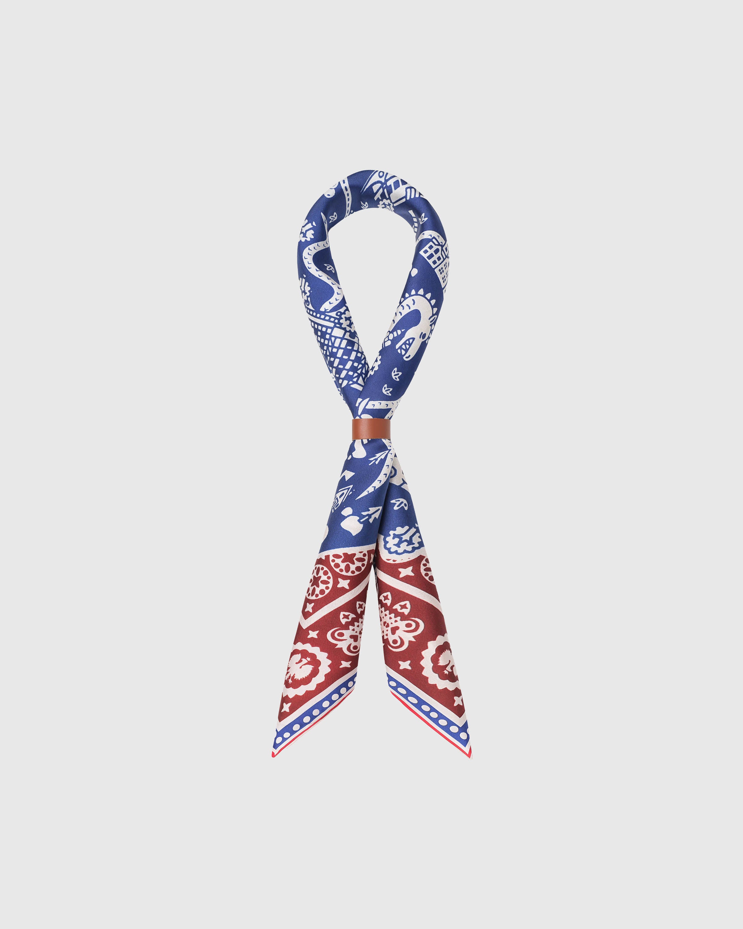 STICKYZOO storybook map silk scarf knotted through a leather ring showing the cobalt cartography