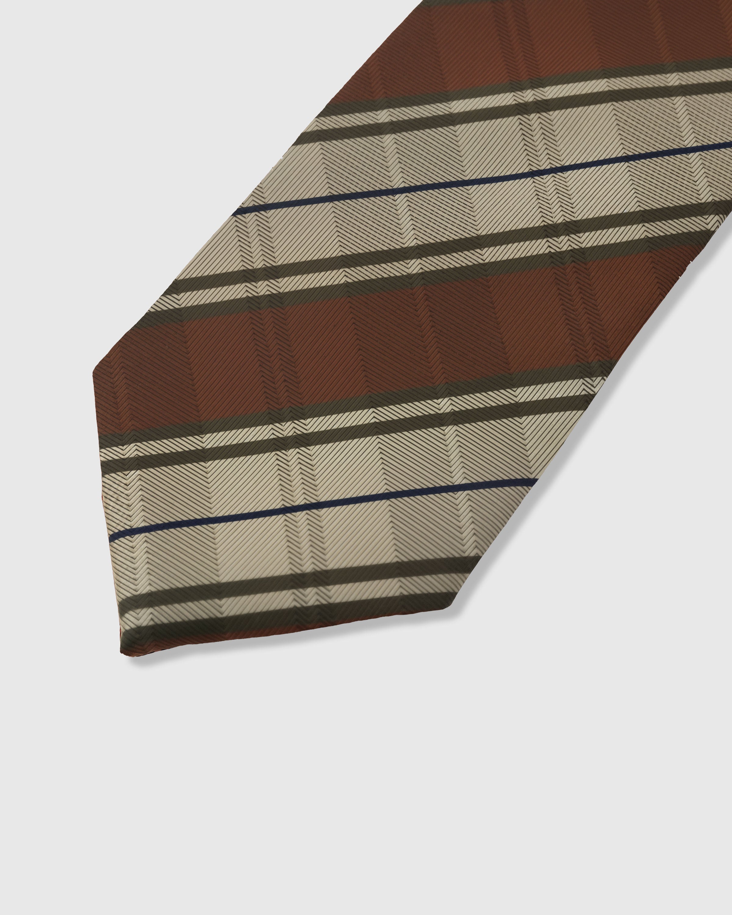 Herringbone stripe detail on umber mulberry silk tie showing raised hand-embroidered thread with navy pinstripe by STICKYZOO