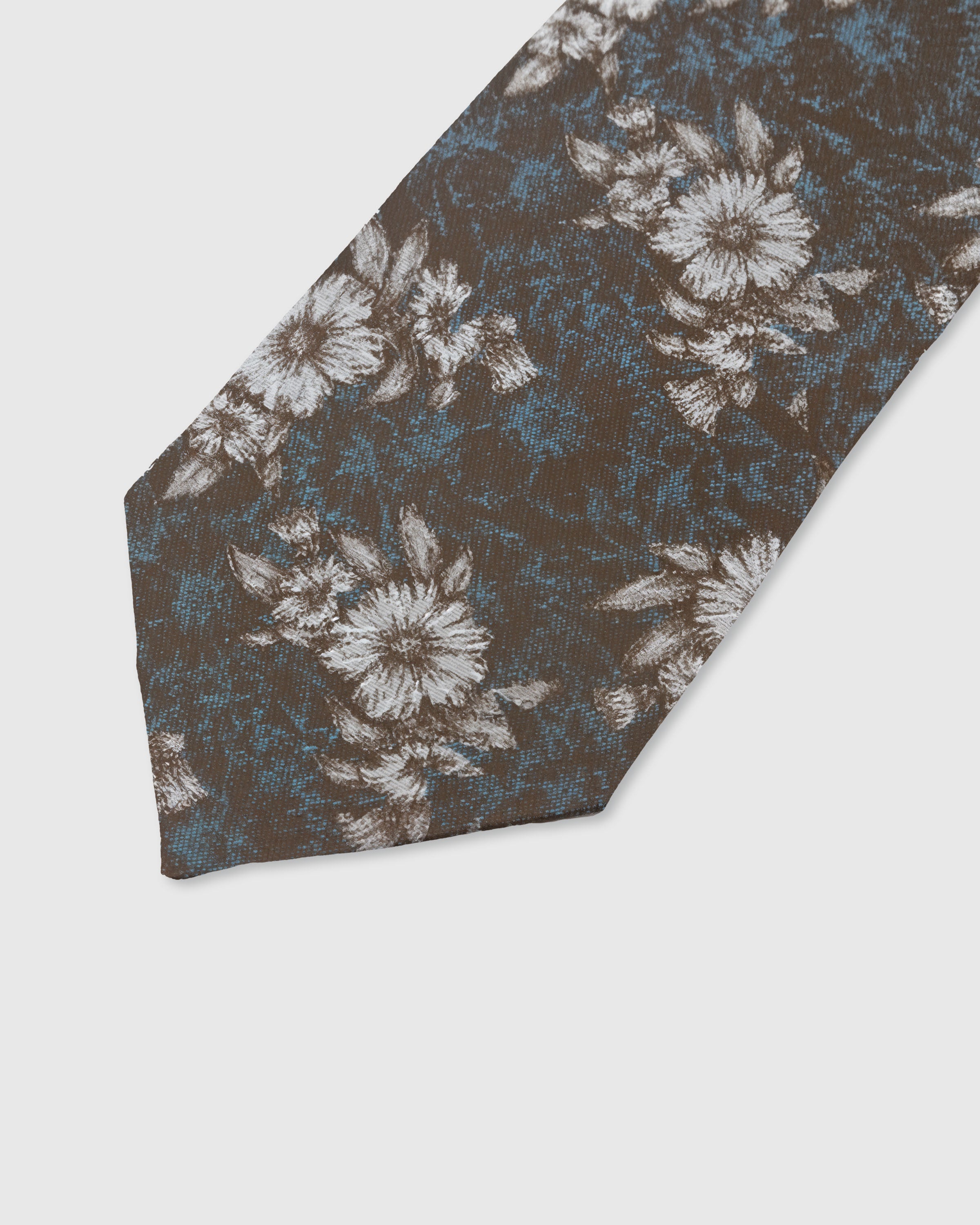 UMBER FLORAL TIE — 45° Italian bias-cut construction with structured interlining, hand-finished slip stitching visible on interior