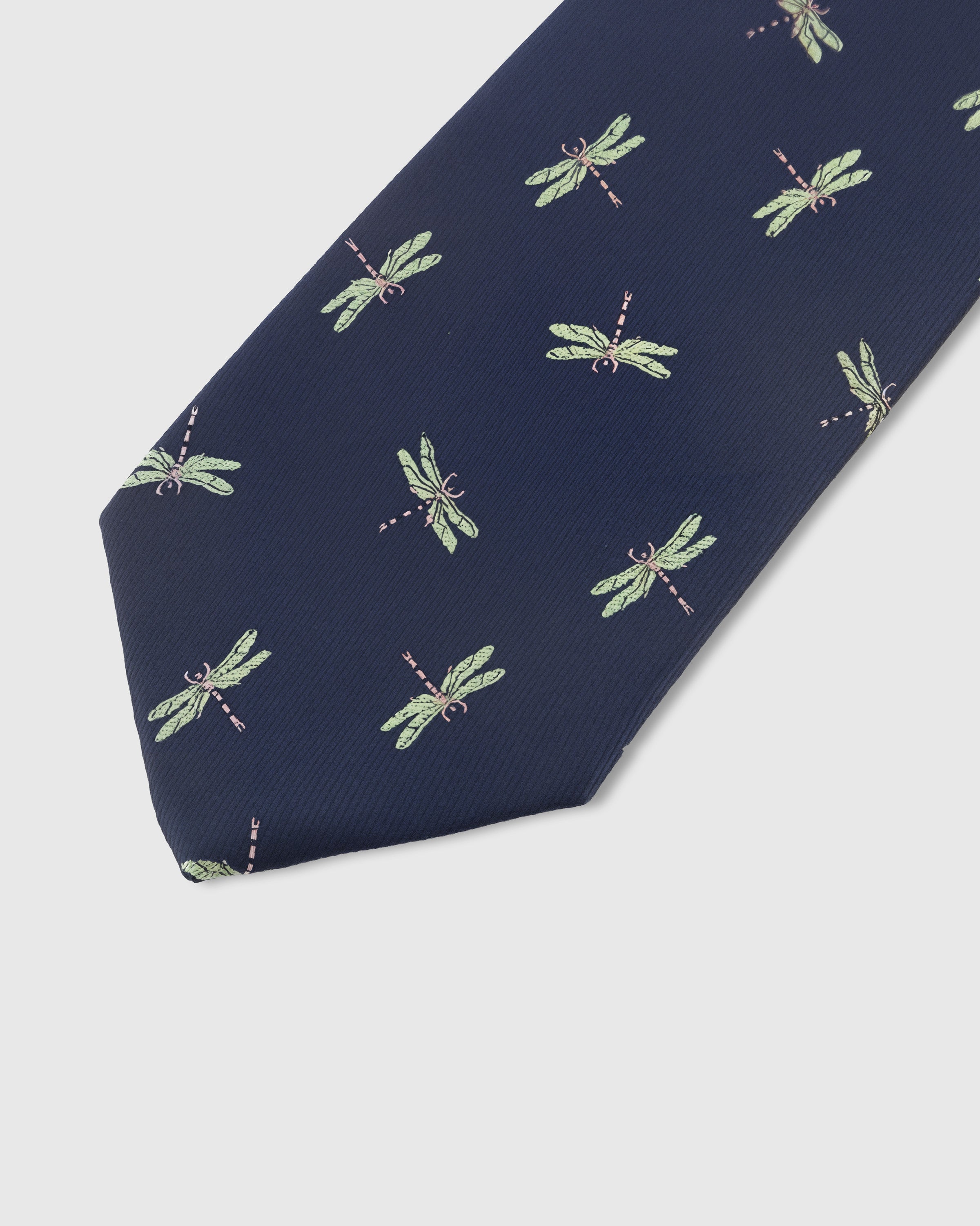 Sage dragonfly motif detail on navy mulberry silk tie showing raised hand-embroidered wings and body by STICKYZOO