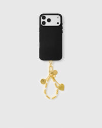 Full phone with golden orbit pearl strap attached on light grey background