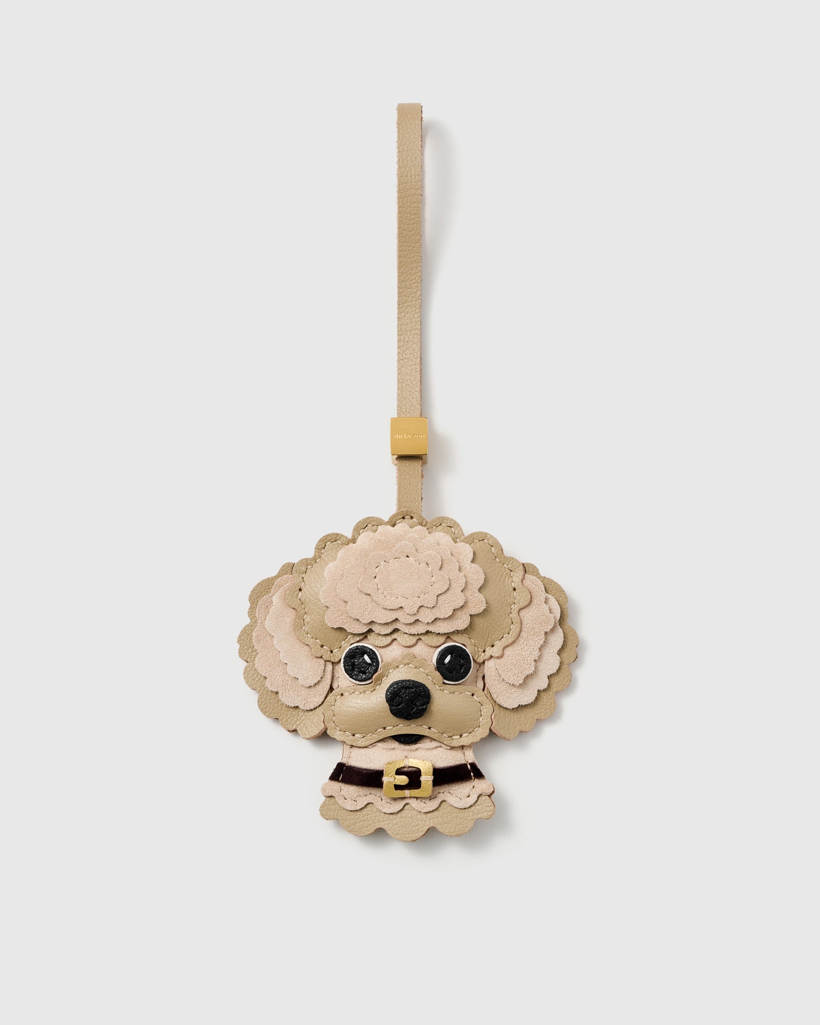 {{Also in Cream}} STICKYZOO poodle charm in cream French Alran leather and suede with scalloped curls, burgundy collar, and 18K gold-plated hardware