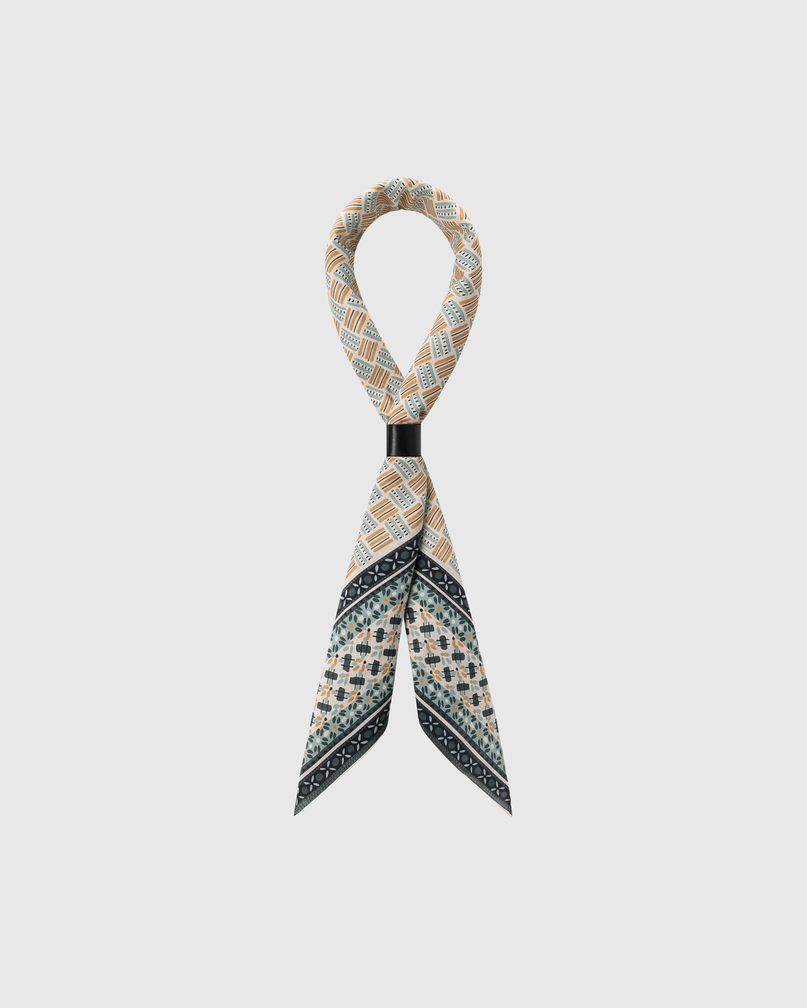 STICKYZOO mosaic tile silk scarf looped and knotted showing the saffron and charcoal print