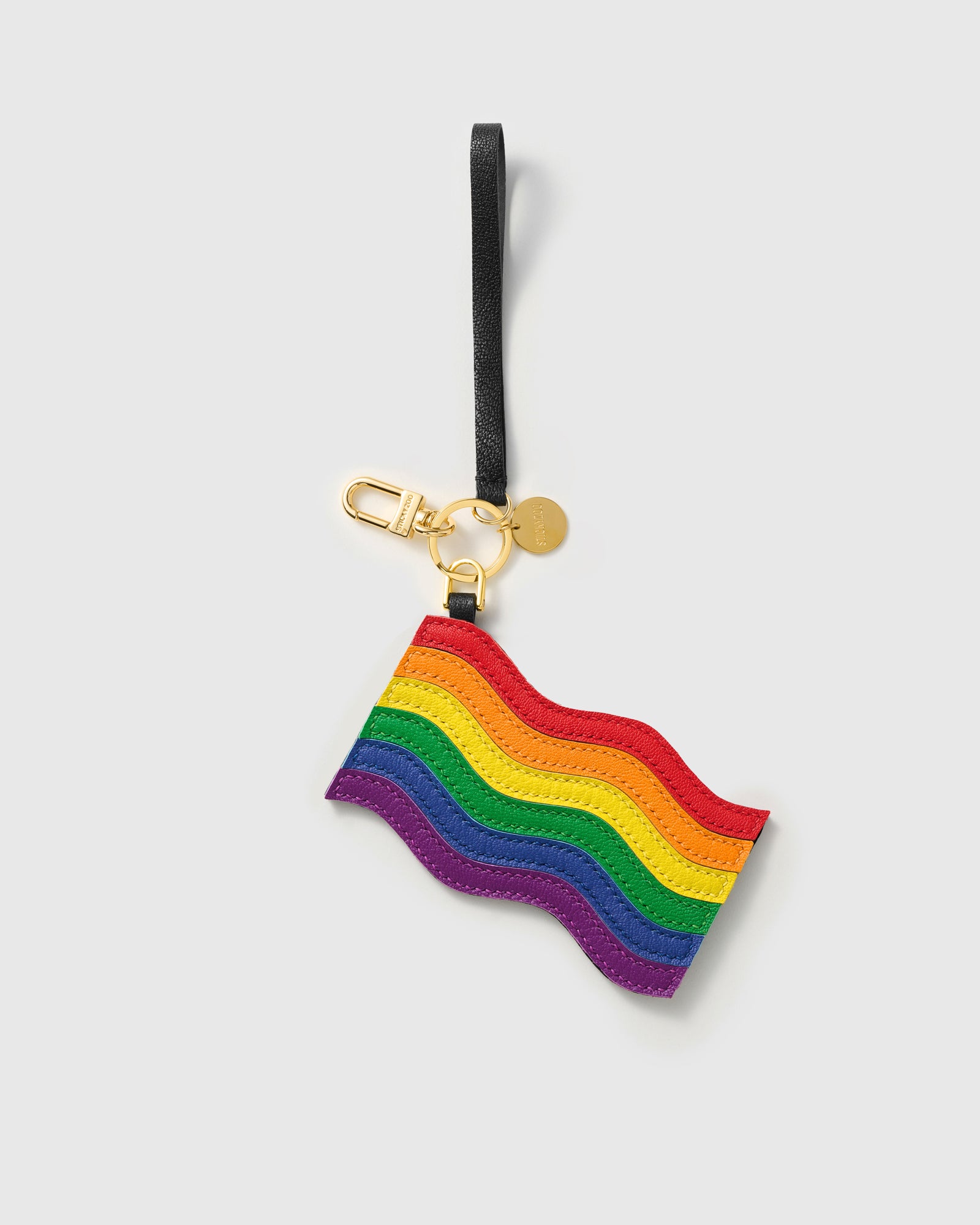 Pride rainbow flag charm with gold keychain clasp, split ring, and engraved STICKYZOO coin