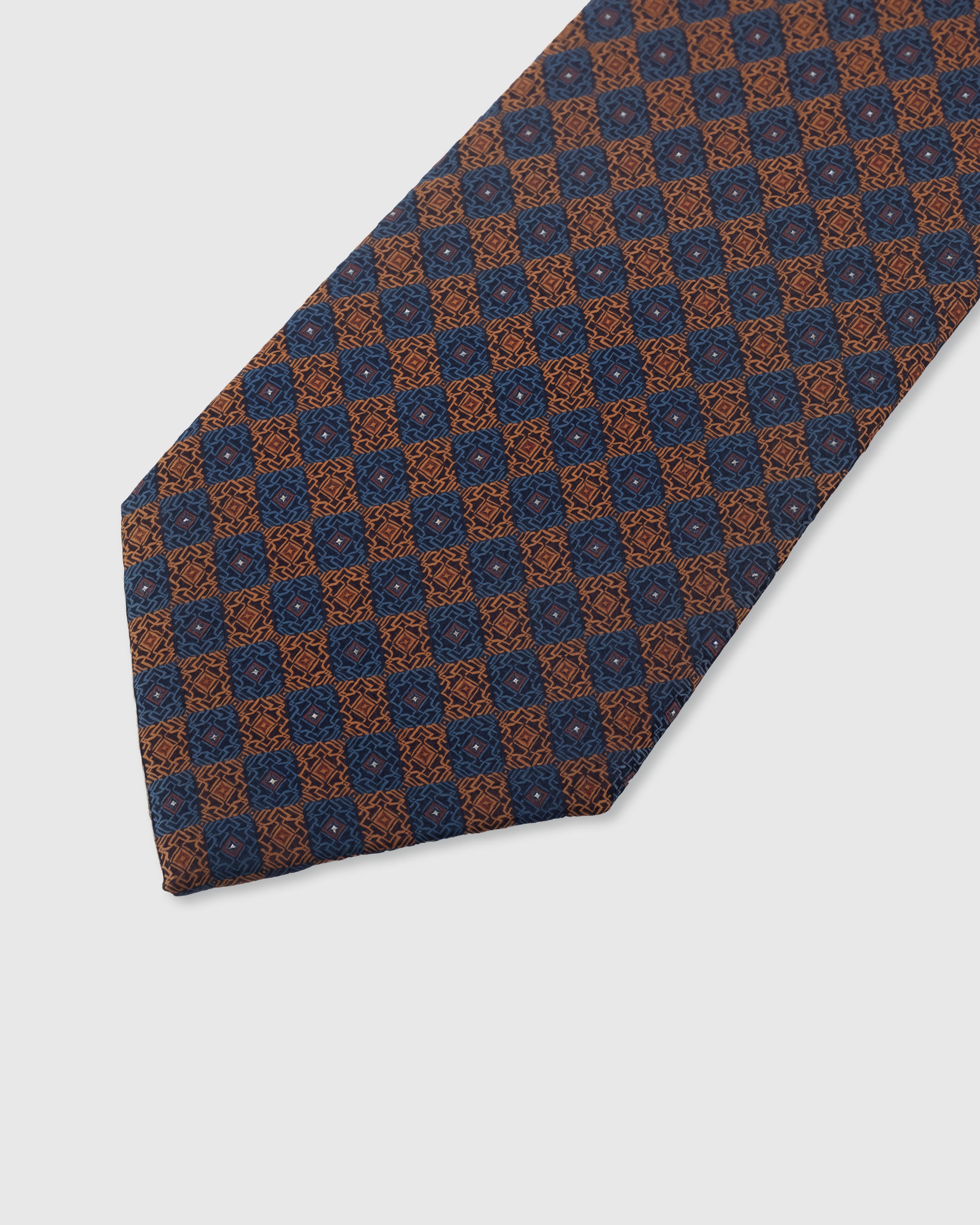 {Embroidered copper mosaic tile detail} Mosaic tile detail on midnight navy mulberry silk tie showing embroidered pattern by STICKYZOO