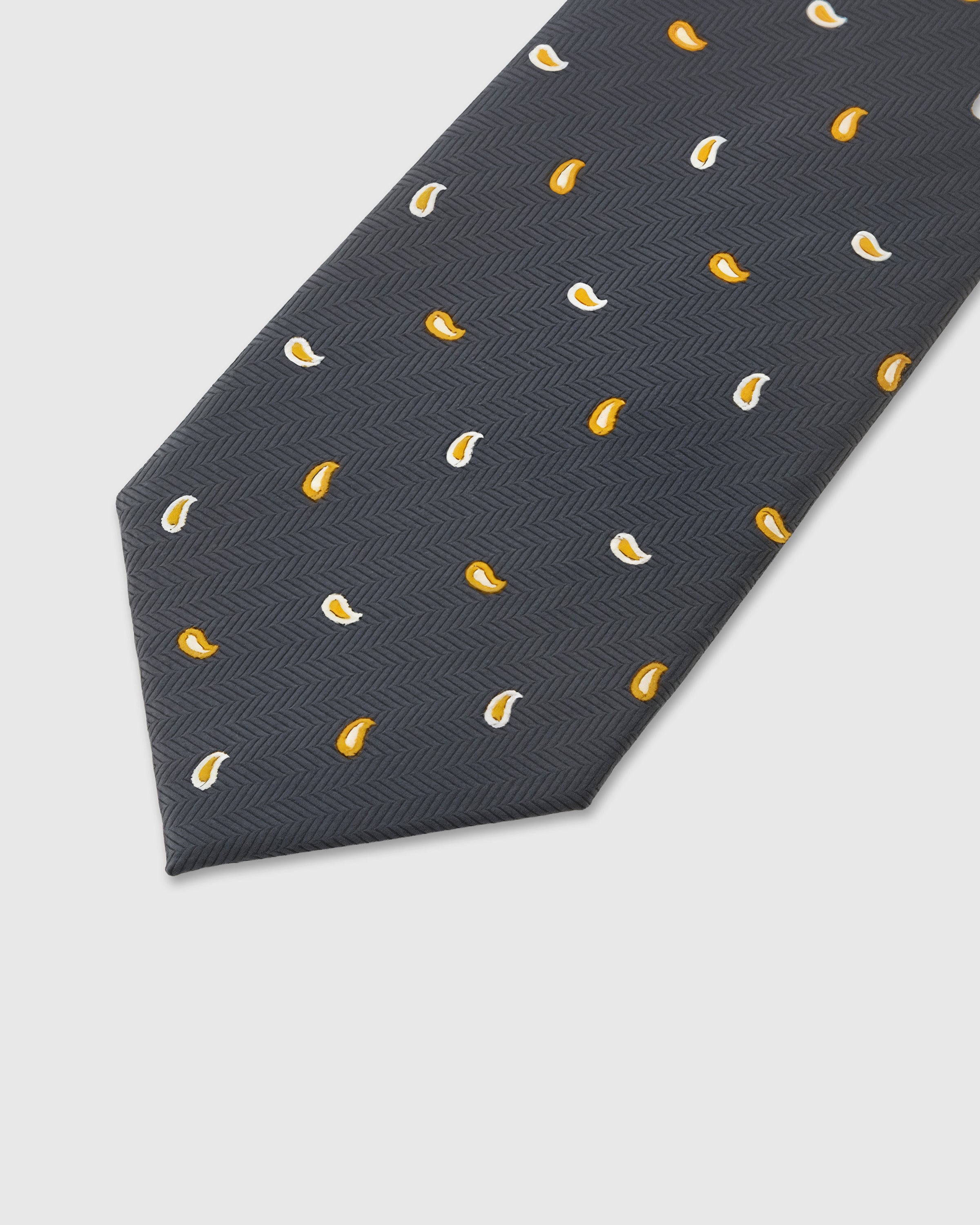 Gold paisley drop detail on slate mulberry silk tie showing raised hand-embroidered thread by STICKYZOO