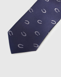 Embroidered, not printed STICKYZOO Midnight Horseshoe Tie flat blade showing repeating silver horseshoe motifs on midnight navy silk