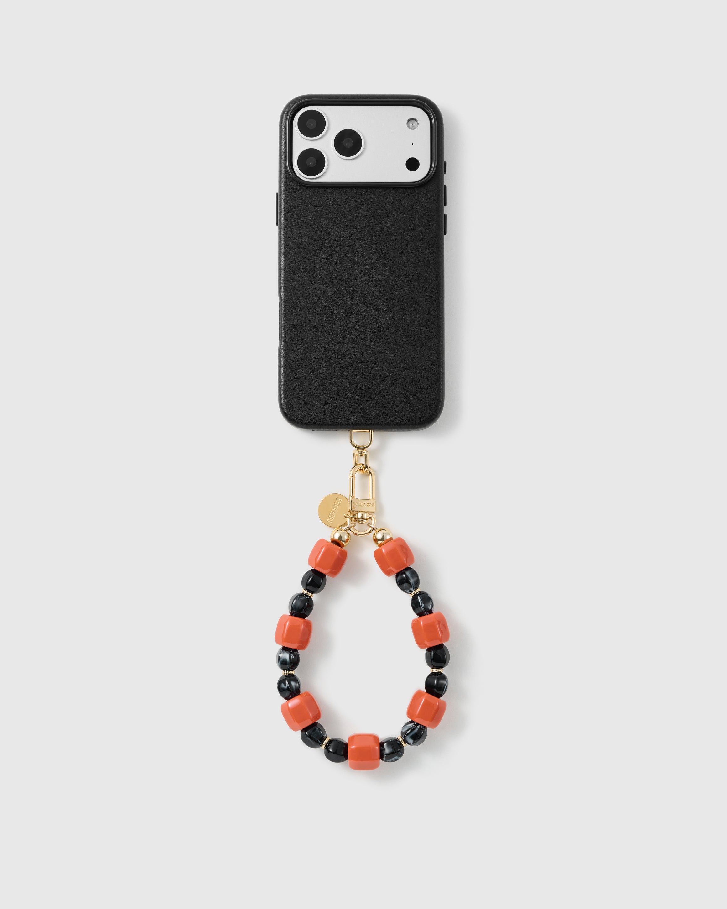 Handmade beaded phone strap on a black case, rated 4.9 across 5,000+ reviews