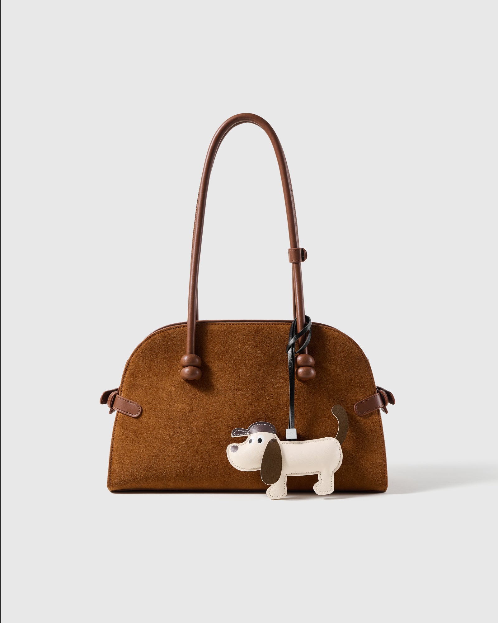 STICKYZOO leather puppy charm shown on a bag, gift-ready and made to be kept