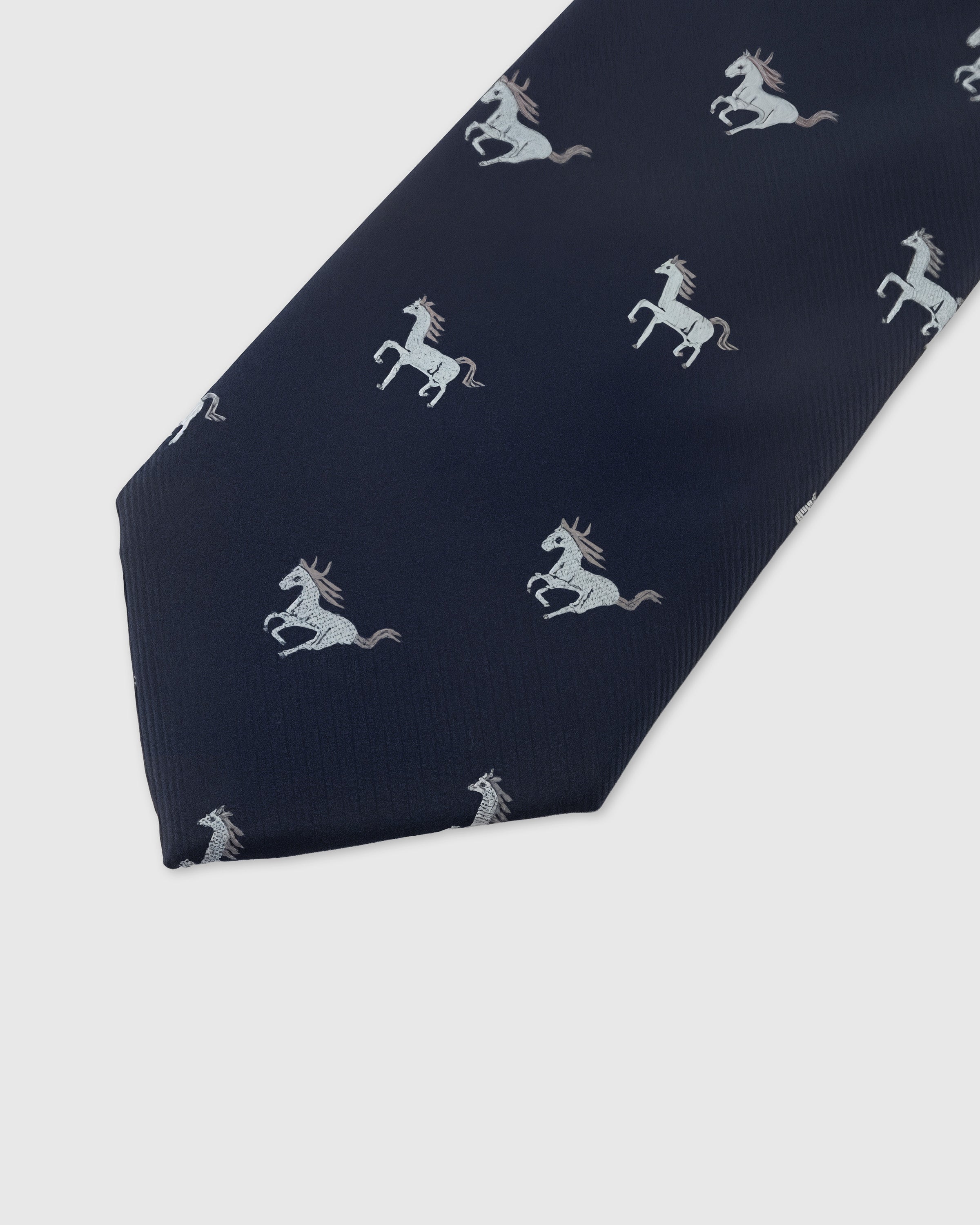 NAVY STALLION TIE — 45° Italian bias-cut construction with structured interlining, hand-finished slip stitching visible on interior