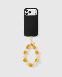 Black phone with saffron marble mix strap attached showing full product pairing
