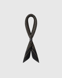 STICKYZOO onyx seed silk scarf shown looped to show the silk fall and the scattered gold seed motif