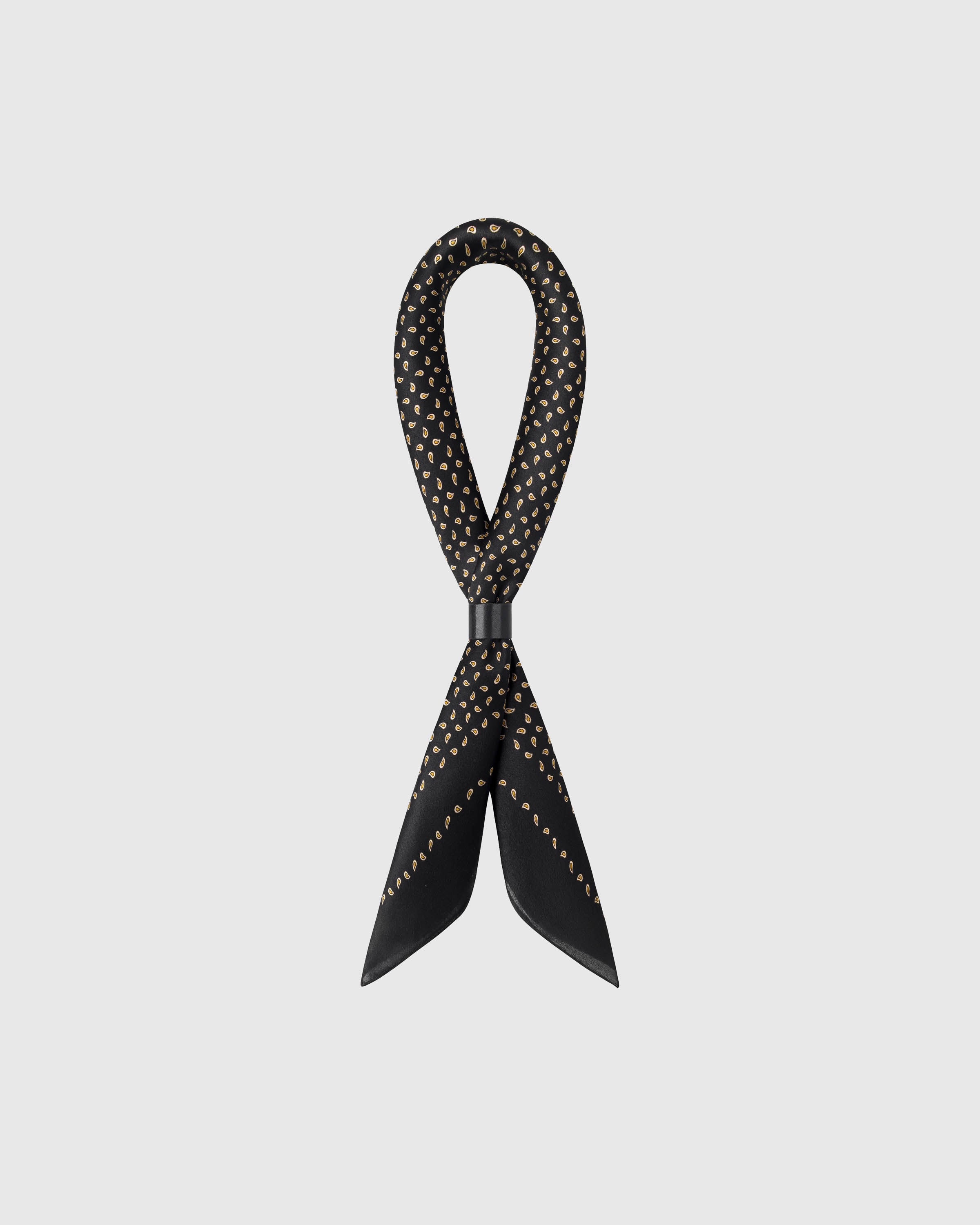 STICKYZOO onyx seed silk scarf shown looped to show the silk fall and the scattered gold seed motif