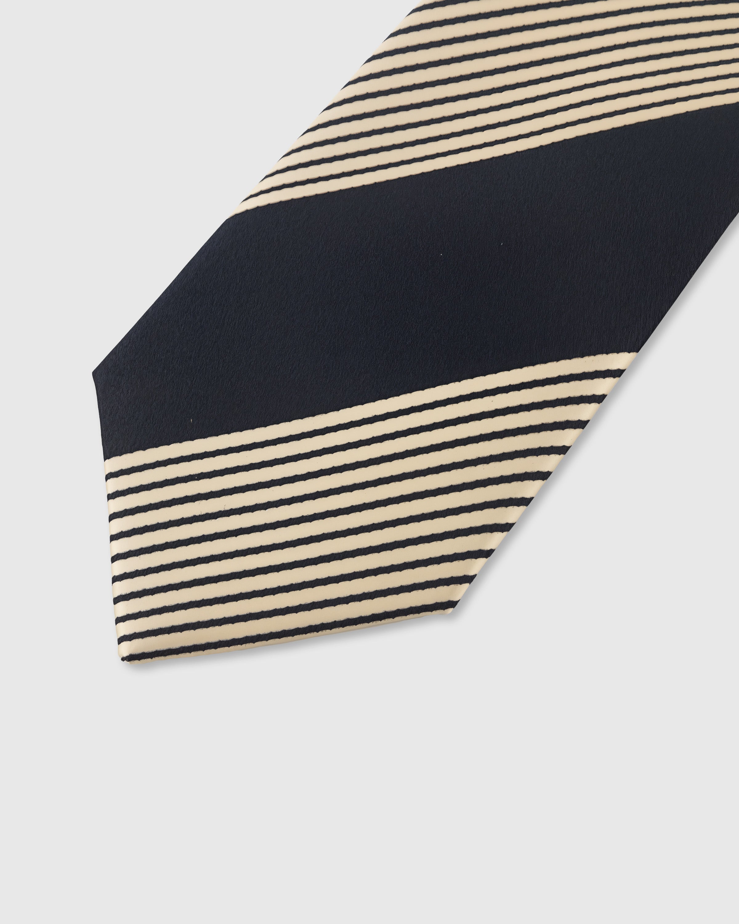 MIDNIGHT BLOCK STRIPE TIE — 45° Italian bias-cut construction with structured interlining, hand-finished slip stitching visible on interior