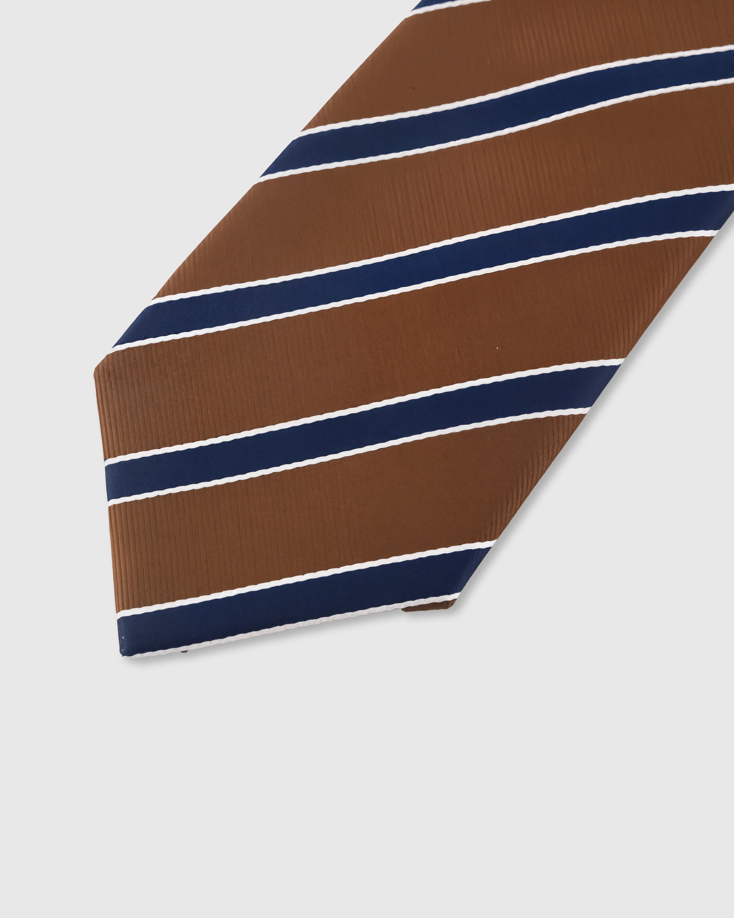 Navy regimental stripe with white piping detail on cognac mulberry silk tie showing raised hand-embroidered thread by STICKYZOO