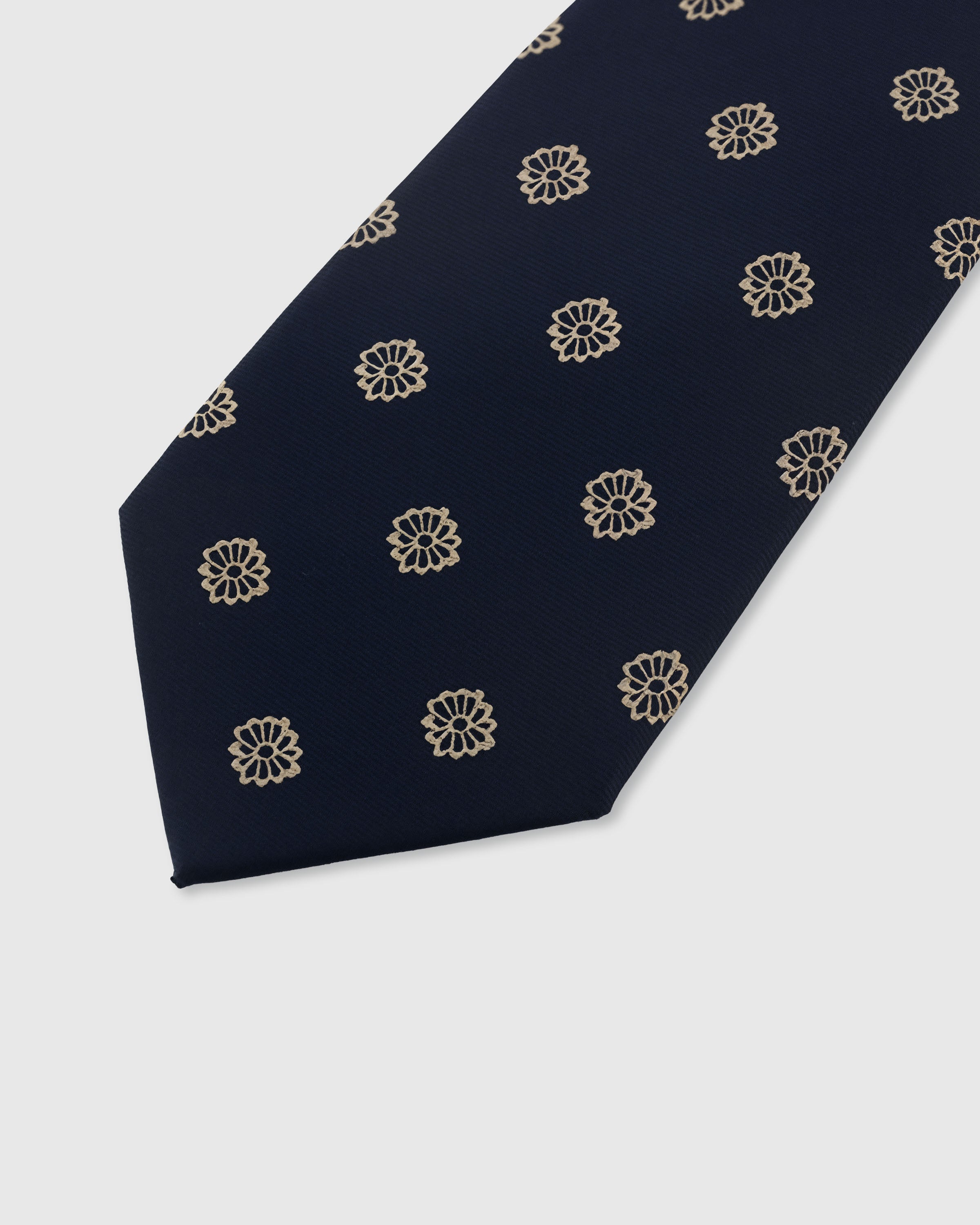 {Embroidered champagne rosette detail} Rosette detail on midnight navy mulberry silk tie showing embroidered pattern by STICKYZOO