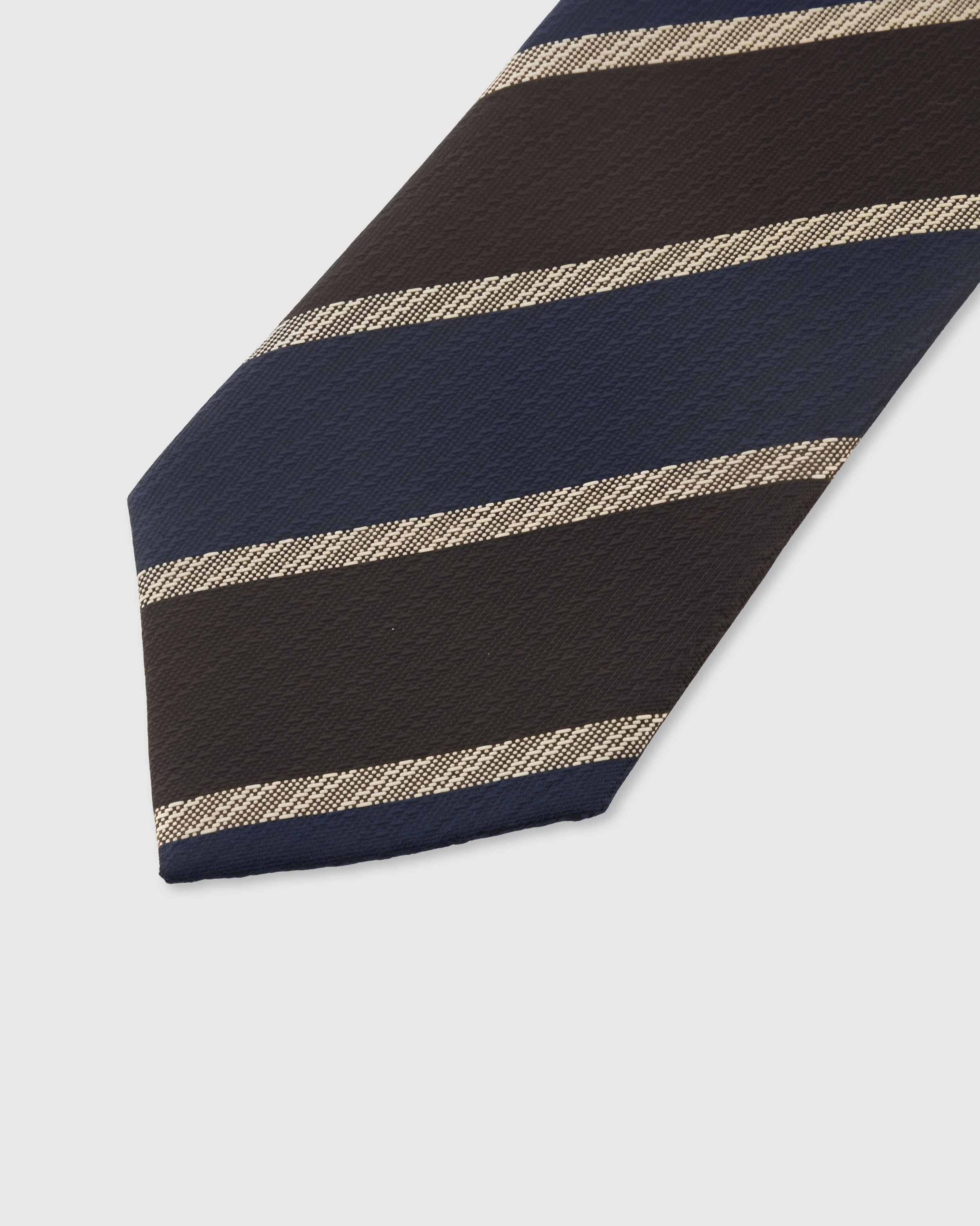 ESPRESSO NAVY STRIPE TIE — 45° Italian bias-cut construction with structured interlining, hand-finished slip stitching visible on interior