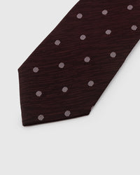Silver-white embroidered pin dot detail on deep claret mulberry silk showing raised tactile thread by STICKYZOO