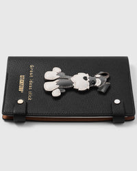 Schnauzer charm detail showing hand-layered grey and white leather body, stitched beard and brows on STICKYZOO A5 notebook