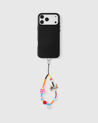 Full phone with clown dog strap attached on grey background