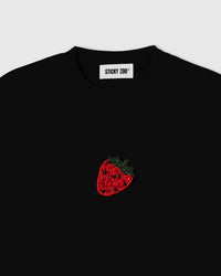 Hand-beaded glass strawberry on the black tee showing red seed beads, faceted accents and black seed beads on 230gsm cool-touch cotton.