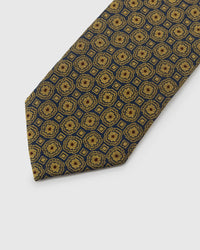 Gold octagonal foulard motif on navy mulberry silk tie showing hand-embroidered raised thread by STICKYZOO