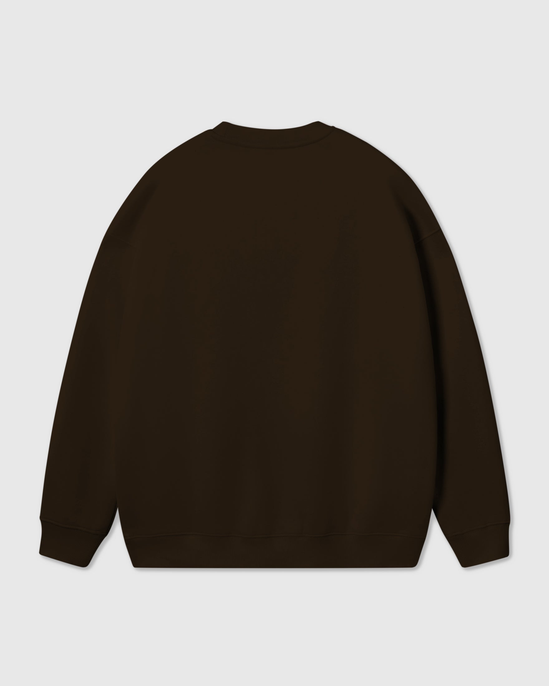 Model wearing Poodle Parade Sweatshirt in dark brown showing dropped shoulders and relaxed fit
