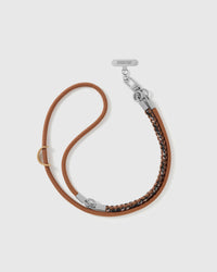 STICKYZOO cross-body phone strap laid flat beside the phone case it attaches to