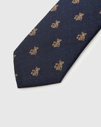 Embroidered, not printed STICKYZOO Atlas Bear Tie flat blade showing repeating teddy bear motifs on navy geometric mulberry silk