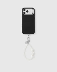 Ivory heart pearl phone strap attached to black phone case showing universal fit