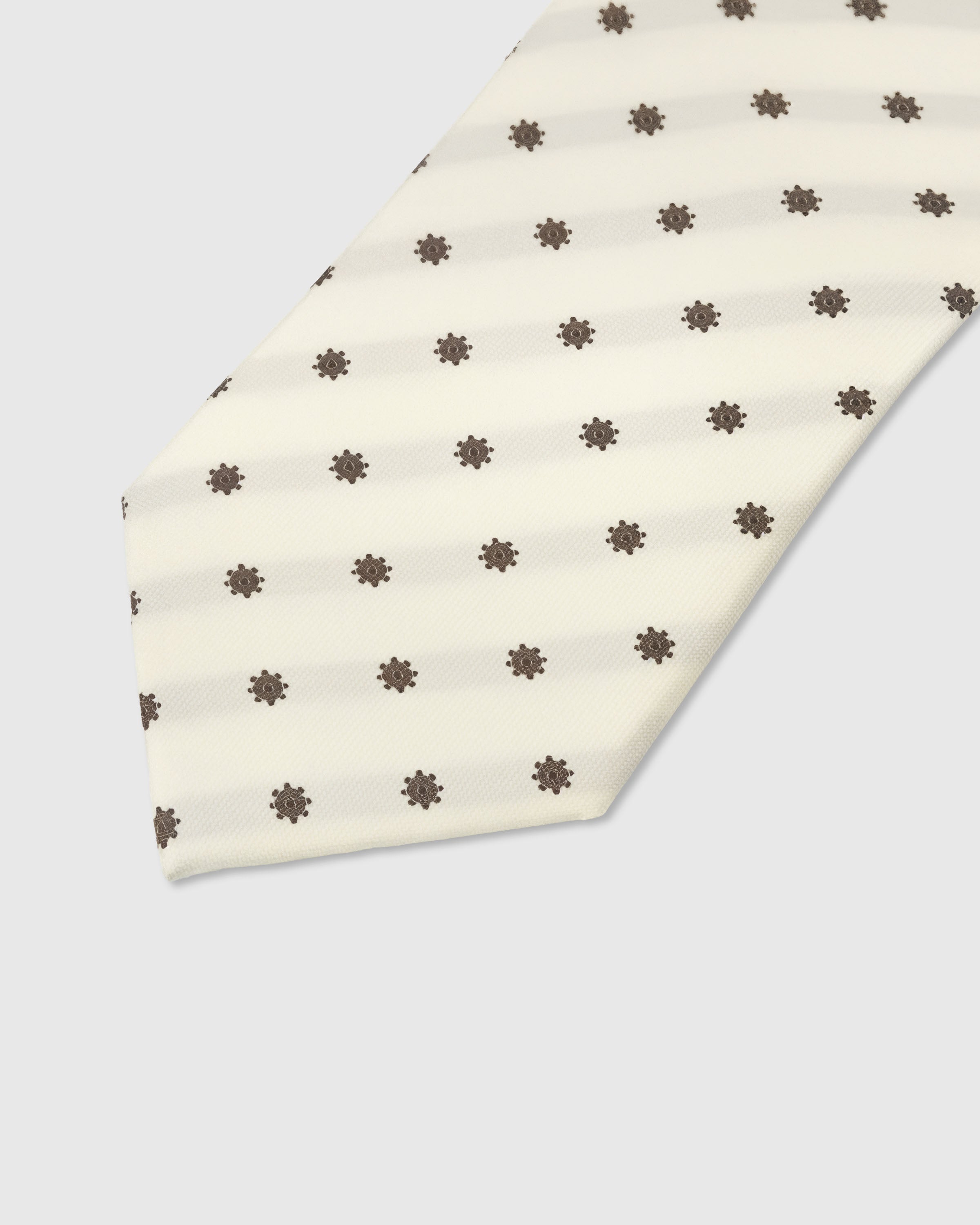 Cocoa floret dot detail on ivory mulberry silk tie showing raised hand-embroidered thread by STICKYZOO
