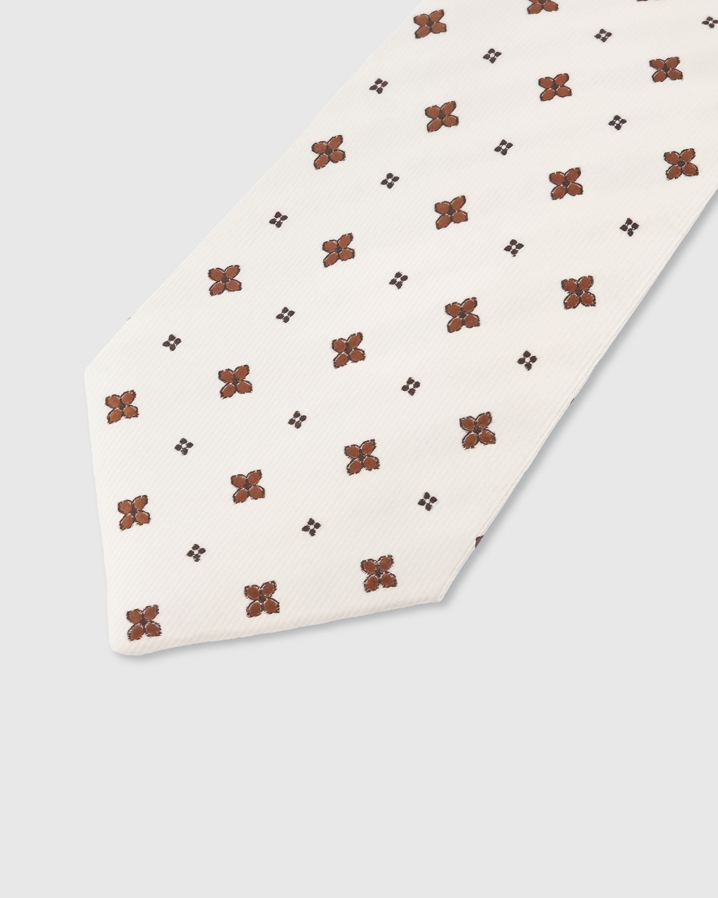 STICKYZOO Ivory Clover Tie — detail of hand-embroidered spaced clover motif on pure mulberry silk