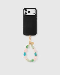 Full phone with sorbet marble mix strap attached on light background